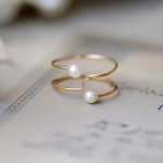 bague or perle de culture blanche