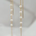 boucle d'oreille pendante avec perle