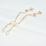 boucle d'oreille pendante avec perles
