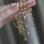 collier élégant perles or